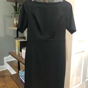 Knee-length, black pencil dress.
